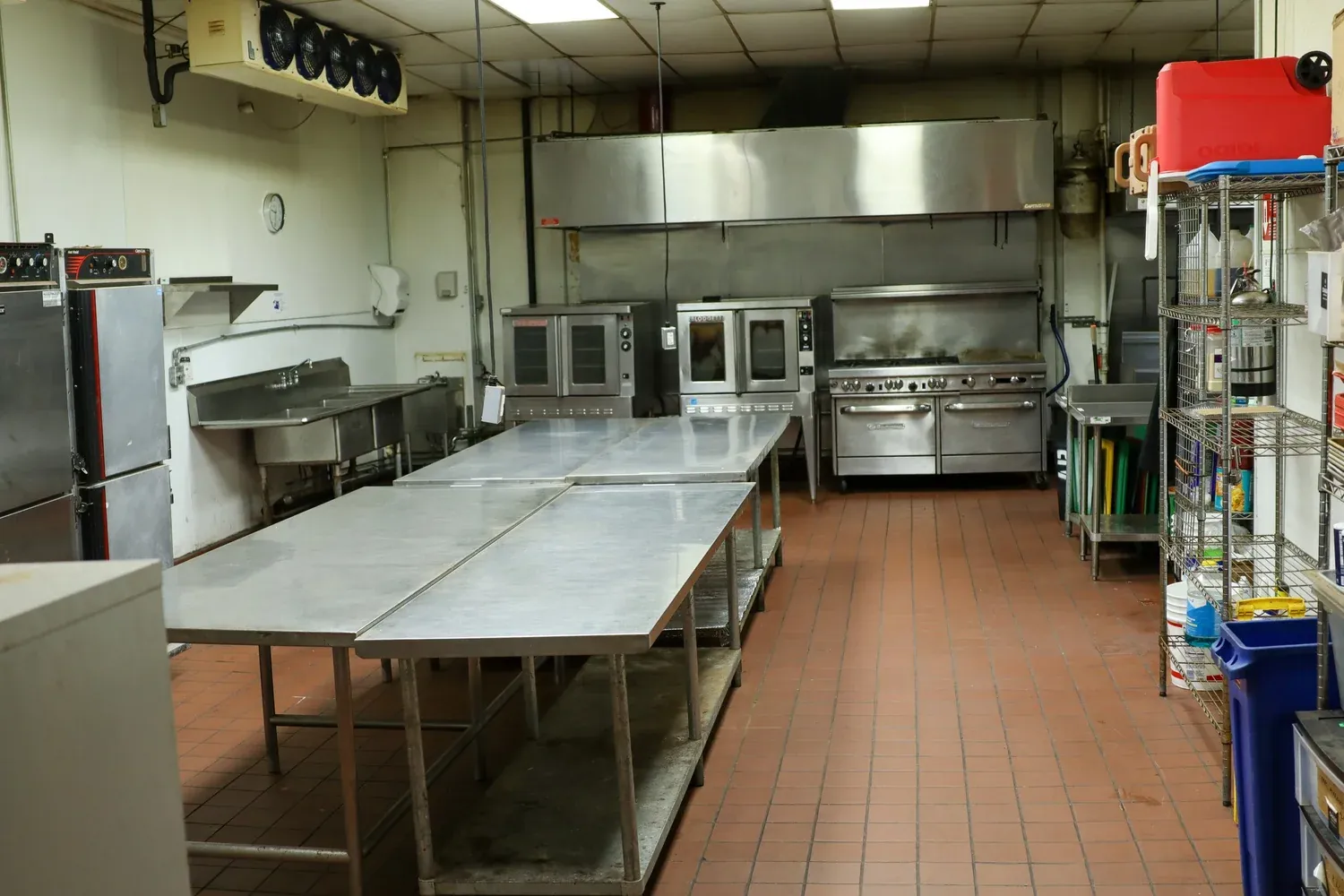Open stainless prep tables under the Type-1 hood